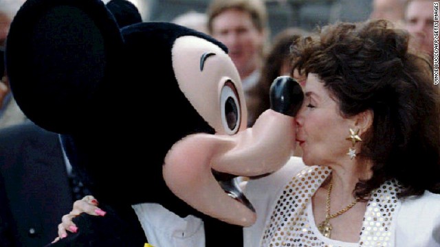 Funicello gives Mickey Mouse a kiss in 1993 after receiving a star on the Hollywood Walk of Fame.